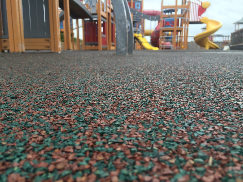 Wetpour surfacing and wet weather